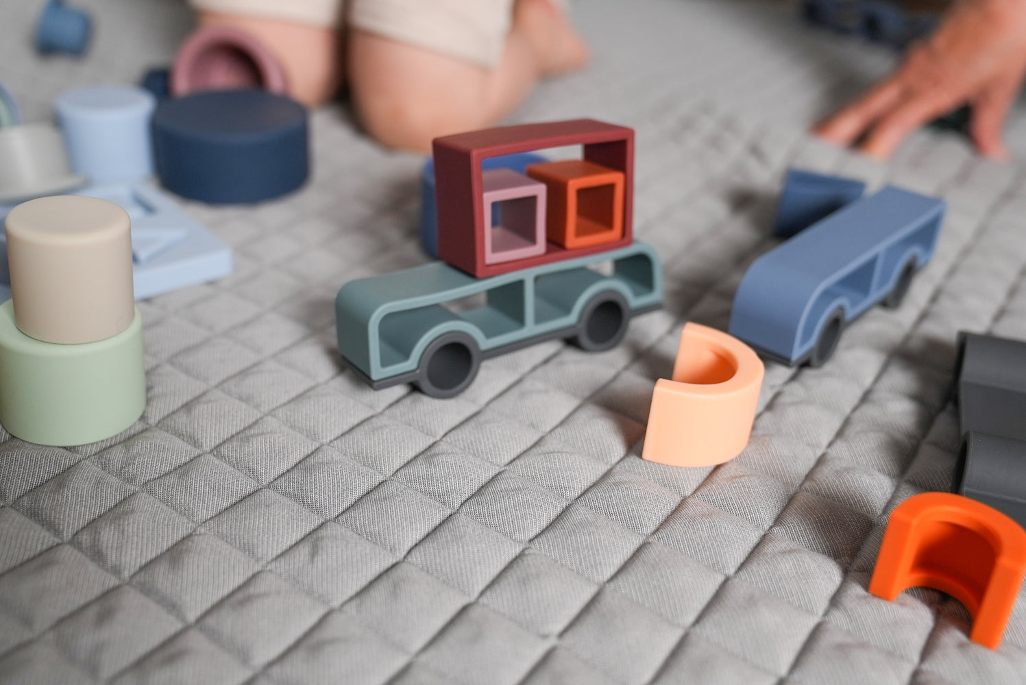 play and create with silicone car and truck stacker toy