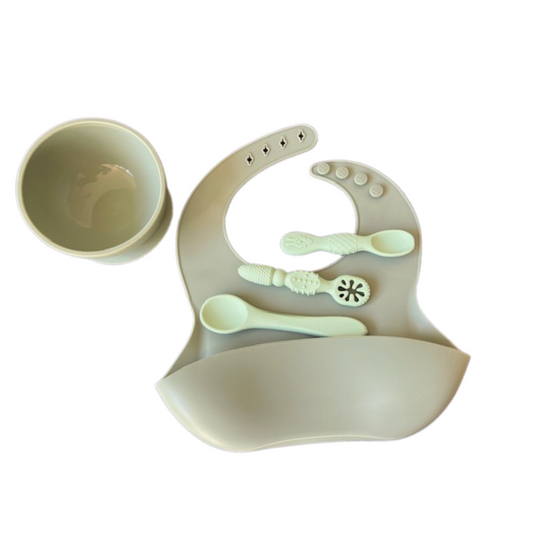 Silicone bib and suction bowl together with 3 mint spoons to assist self feeding baby milestones