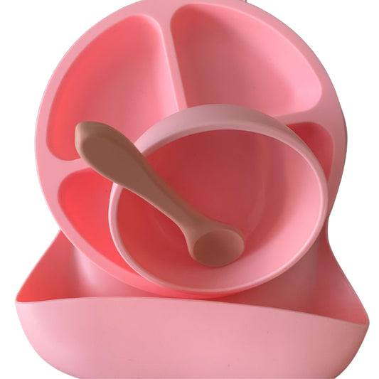 Pink Mealtime Bundle. Infant bib with food catcher, suction bowl and divided plate and blush spoon.